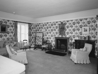 Interior.  Second floor. Principal guest bedroom with dramatic floral wallpaper.