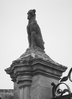 Detail of hound on top of gate pier.