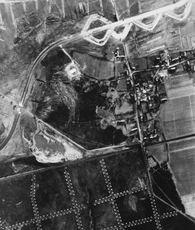 RAF WWII vertical aerial photograph of the NE part of Dallachy Airfield during the construction phase.  Visible is part of the perimeter track and taxiways.  Also visible is the small village of Nether Dallachy and an area of freshly dug anti-landing ditches to the NE of the village.