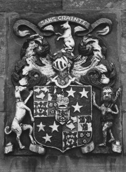 Detail of heraldic panel on N front.