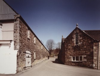 View from W showing Duty Free Warehouse No 3 (L) and offices (R). 
