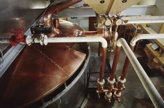 Interior.
Elevated view within Mash House of mash tun and grist hopper.