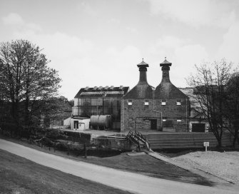 General view of main production block of distillery (left: Still House, centre: kilns) from W