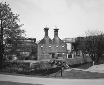 General view of main production block of distillery (left: Still House, centre: kilns) from NW