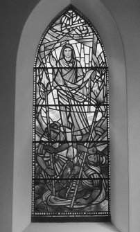 Interior. N wall E stained glass window by Charles Florence of The Risen Christ dated 1969