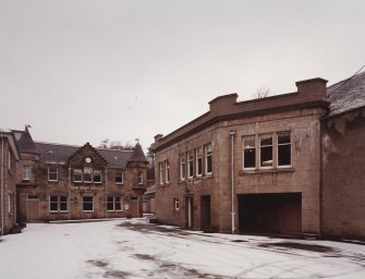 View from ESE of yard and Reception Centre, with Office Building to right.