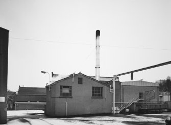 View from W of W end of central block of distillery, showing Boilerhouse and Tun Room.