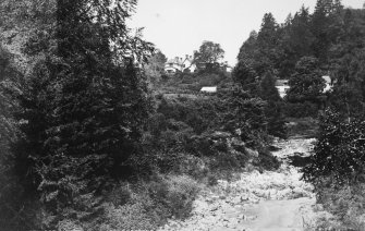 Photographic copy of postcard from photograph album.
View of house from River Divie.
Titled: 'Relugas House on the Divie, Forres', '1047'.