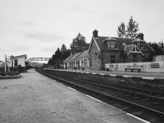 View from platform of station buildings, station master's house and footbridge