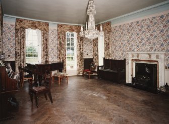 Interior. View of drawing room from NE showing the windows and fireplace