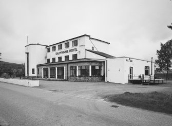 View of frontage with Bill's Bar at right from SE