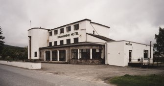 View of frontage with Bill's Bar at right from SE