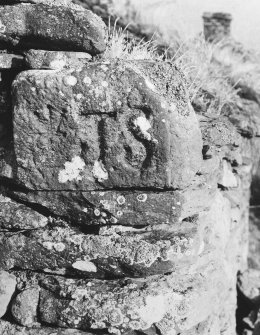 Incised skew-put on south west side of west gable