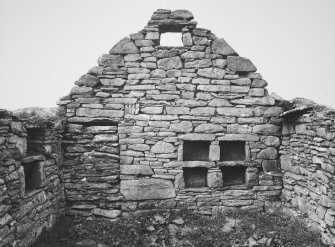 Dwelling, mural recesses, vent and blocked doorway on east face of partition wall