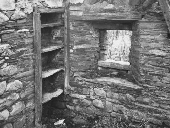 Stone-shelved cupboard in north angle of south east apartment of dwelling