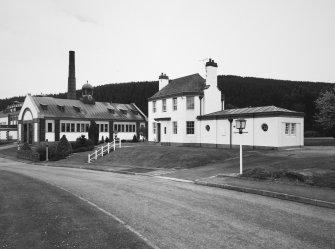 Exterior view from NW of Customs & Excise House (now Manager's House) and former cooperage (left)