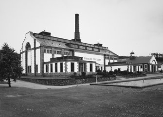 Exterior view from ENE of main block, with former cooperage (right)