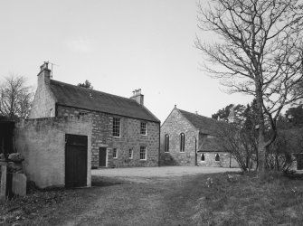 Church and Manse. General view from SE