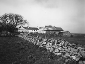 Distant view from south east showing stables and house