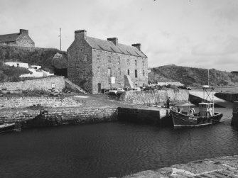 General view of harbour and warehouse from south west