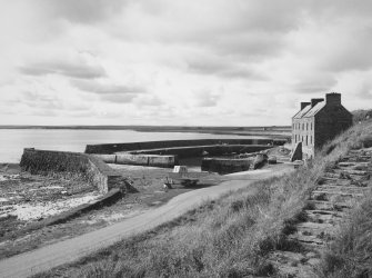 View of harbour and warehouse from south east