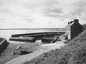 View of harbour and warehouse from south east