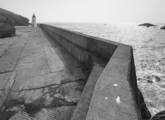 Lybster Harbour
An elevated view along the breakwater wall towards the lighthouse with the Moray Firth beyond