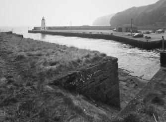 Lybster Harbour
An elevated view looking south-west out towards the harbour mouth, the lighthouse and the Moray Firth in the distance