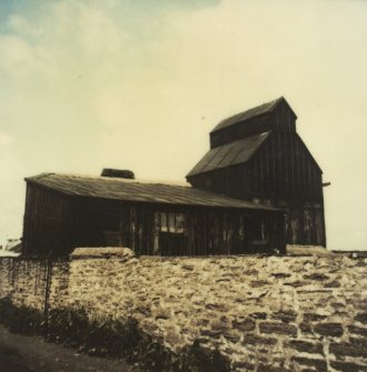 Photographic copy of colour polaroid showing general view of kiln and packing loft.