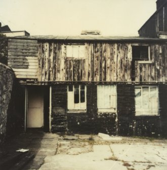 Photographic copy of colour polaroid showing general view of curing shed and packing loft.