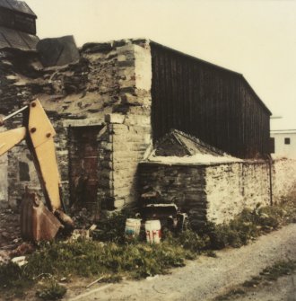 Photographic copy of colour polaroid showing general view of rear of curing shed.