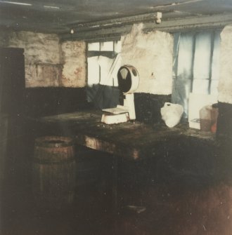 Interior.
Photographic copy of colour polaroid showing view of preparations table and scales.