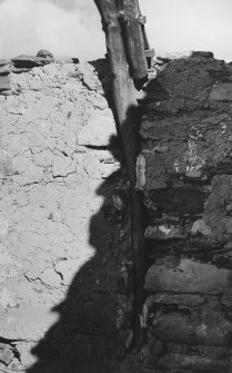 Clay lining on north wall of east apartment and remains of cruck