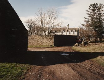 General view of farmhouse and walled garden from East.