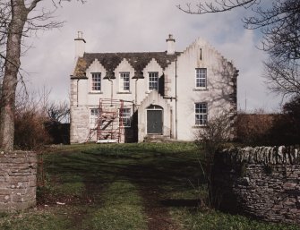 View of farmhouse from gates to South.