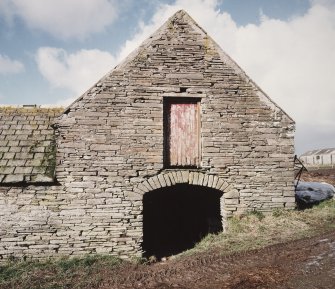 View of arched entrance at East end of stable from East.