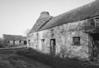 Kiln and granary, view from South West with cottage in background.
