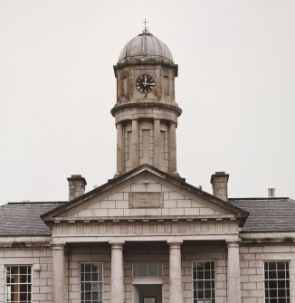 View of clock tower and pediment above main entrance