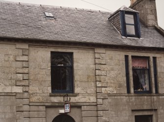 Detail of first floor windows and dormer.