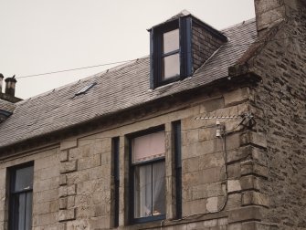 Detail of first floor windows and dormer.