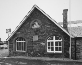 Detailed view from N of gable of booking office at NE corner of station (also showing 1874 plaque)