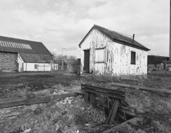 View from SW of wooden store at S side of main station block (left)