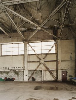 Interior view of southwestern C1 type hangar showing steel roof framing and additional steel support for door area.