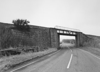 General view of railway bridge from NW, showing granite abutments and single steel truss