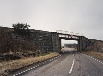 General view of railway bridge from NW, showing granite abutments and single steel truss