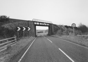 General view of railway bridge from E, showing granite abutments and single steel truss