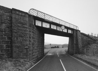 View of railway bridge from NW, showing granite abutments and single steel truss