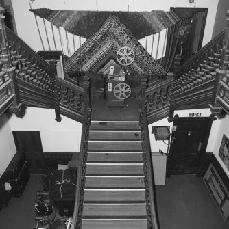 Interior. Elevated view of N wing  former Bishop's Palace  main stair from ESE