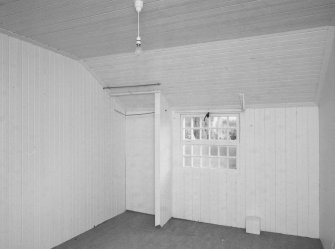 Interior. Tin House, view of a timber lined ground floor room