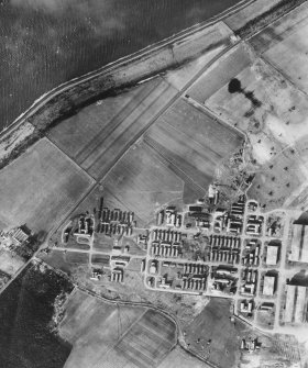 RAF WWII vertical aerial photograph of Dalcross Airfield.  Visible are the main hangars and the technical area to the NW.
